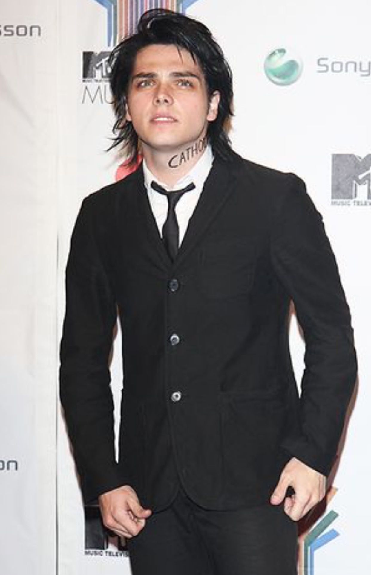 a male in a black suit and tie - Gerard Way’s Height: My Chemical Romance’s Leader