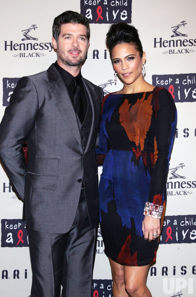 Photo: Paula Patton and husband Robin Thicke arrive at the Keep a Child - Who Is Paula Patton’s Husband? Meet Robin Thicke — Her Ex and Childhood Sweetheart